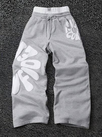 Pantalones de chándal casuales con cordón en la cintura y ajuste holgado con estampado de letras para hombre