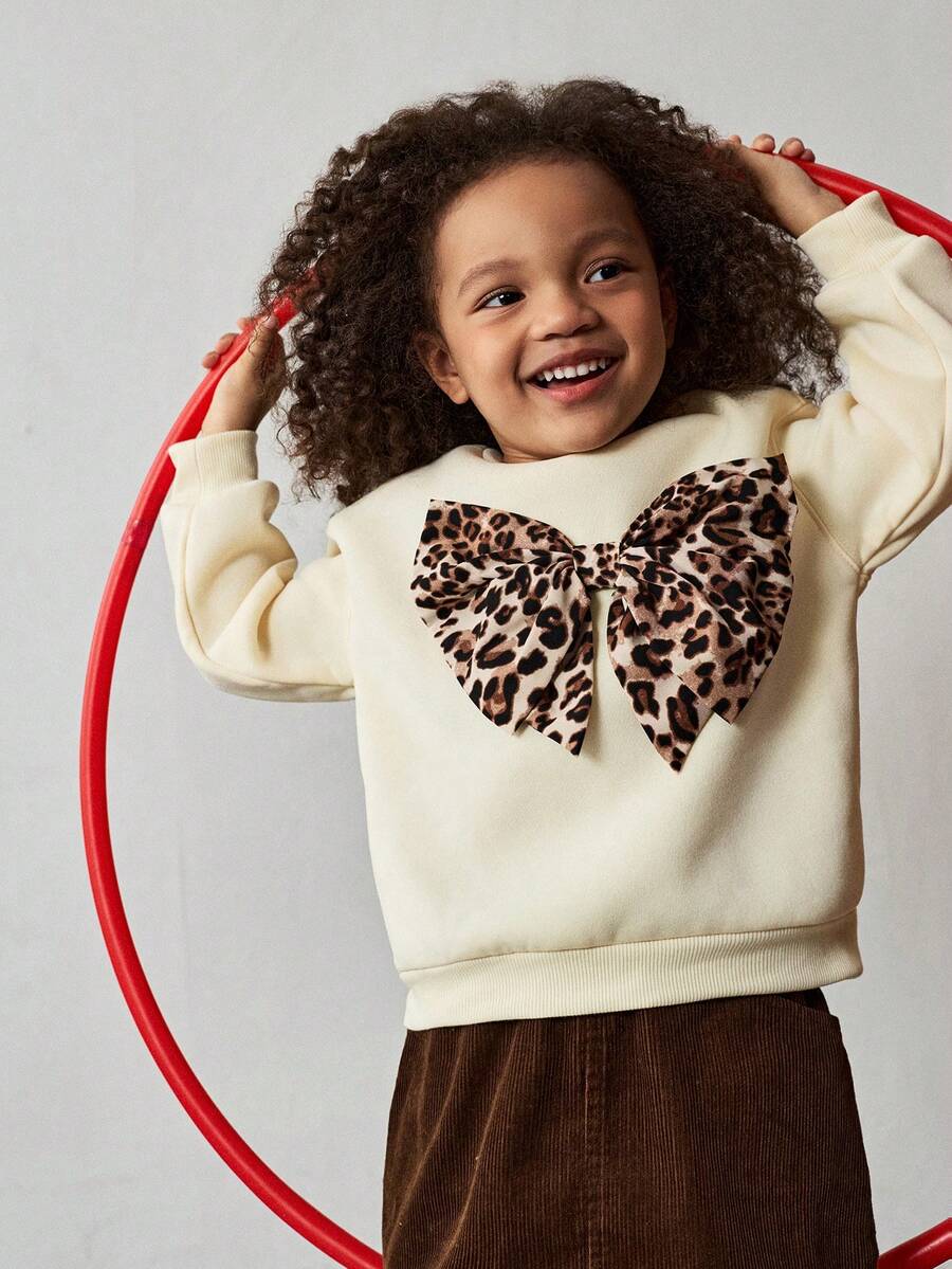 Maija Kids بلوزة كاجوال بياقة مستديرة مزينة بفيونكة بطبعة نمر للبنات الصغيرات