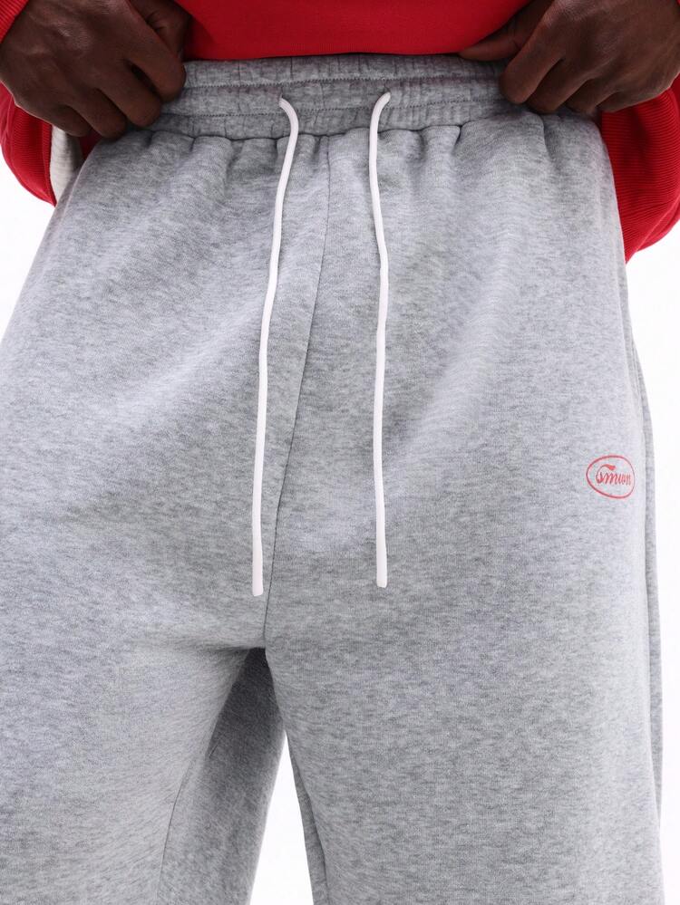 Completo felpa con cappuccio e pantaloni della tuta con coulisse