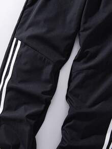 SHEIN Explorewe Pantalones con estampado de rayas asimétrico versátil y combinable para niños preadolescentes