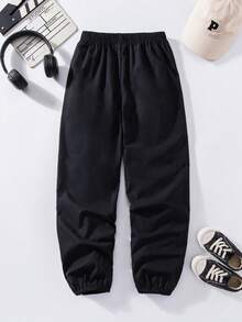 SHEIN Explorewe Pantalones con estampado de rayas asimétrico versátil y combinable para niños preadolescentes