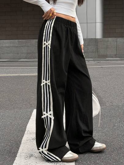 Glowzi 少女蝴蝶结装饰宽松黑色休闲裤，百搭时尚，适合日常穿着