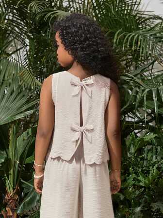 SHEIN Tween Girls' Casual Vacation Minimalist Bow Back Decor Floral Petal Shell Hem Sleeveless Blouse Top, Woven Solid Color