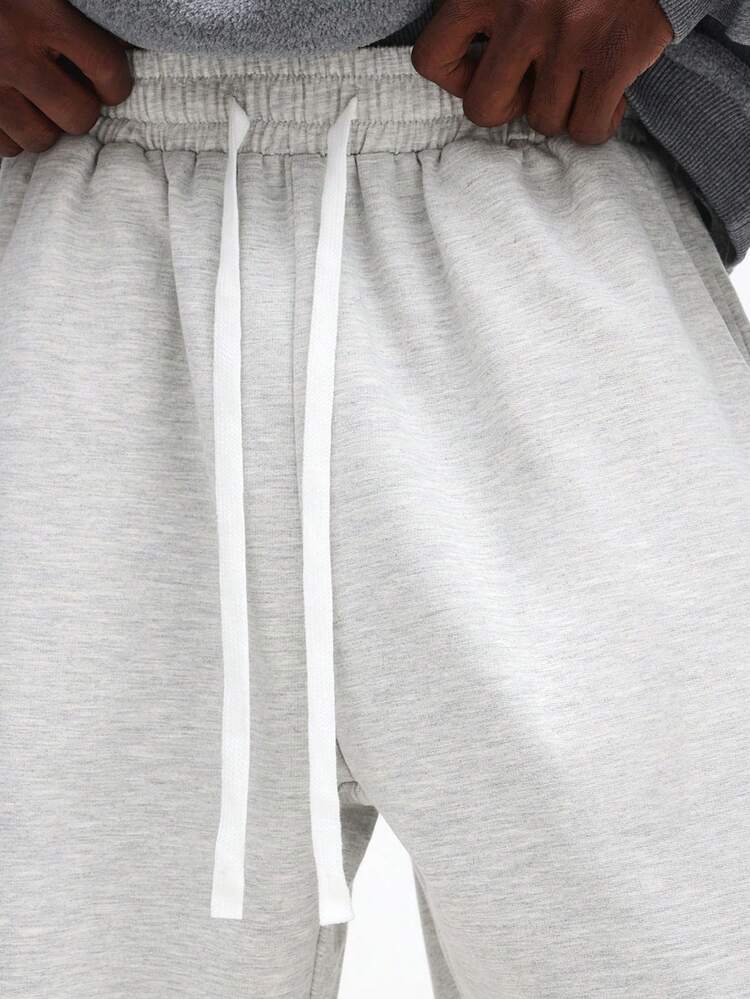 Luźne spodnie dresowe ze ściągaczem i elastyczną talią