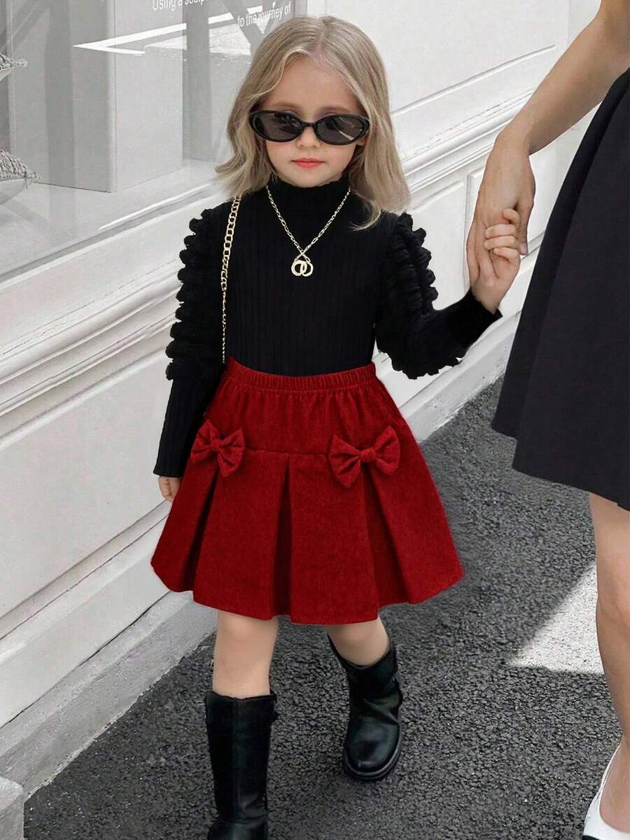 Elladie kids 两件套女童休闲套装：黑色泡泡袖长袖上衣 + 卡其色灯芯绒蝴蝶结半裙，可爱复古风，舒适贴身，适合日常、旅行、上学、聚会等场合。 - 彩色 - 查看 1