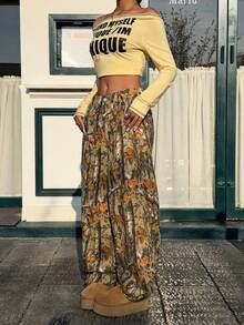 Muchica Spodnie damskie z rozkloszowanym splotem i nadrukiem gałęzi - Wielokolorowe - Zobacz 4