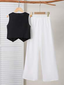 SHEIN Bộ đồ 2 món cho bé gái: Áo vest đen thanh lịch với khuy cài ngọc trai 3D, kết hợp với quần tây trắng, thích hợp cho học sinh. - Nhiều màu - Xem 2