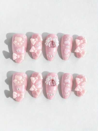 Kawaii 10 Stücke süße Schleifen-Katzen-Klauen-Flügel-Element Fake Nägel + 3 Stücke doppelseitiges Klebeband, Y2K-Stil handbemalte rosa einfarbige abnehmbare mandelförmige Mittellange Nägel, geeignet für Partys, Tänze und den täglichen Gebrauch.