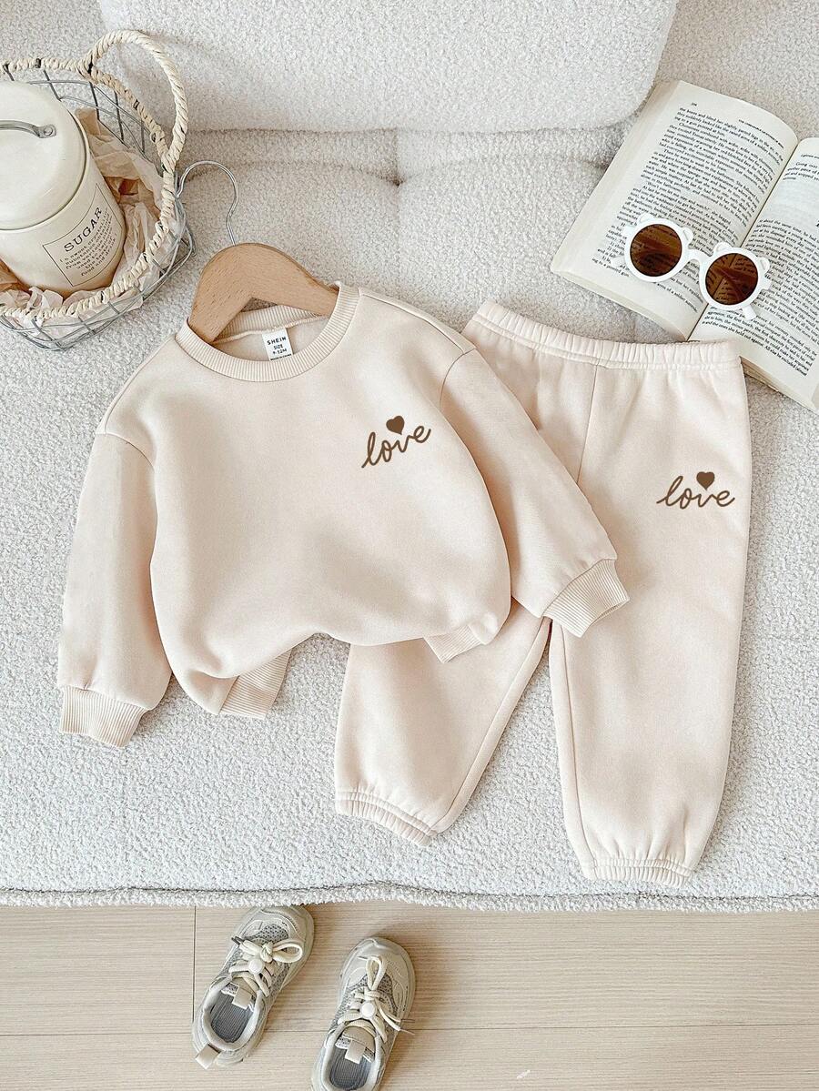 SHEIN Babygirl Cute Apricot Bow Decor Long Sleeve Sweatshirt & Elastic Waist Pants Set, Autumn/Winter Baby Set Autumn Winter Season Neutral Baby Clothes Cream Baby Girl Outfit Baby Girl Sweat Set Baby Casual Sets - Apricot - View 1
