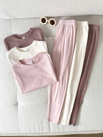 SHEIN 6件套少女秋冬连体衣套装，包括圆领长袖上衣、字母装饰的九分袖长裤、柔软亲肤的保暖内衣，以及一套包含长袖上衣和打底裤的睡衣套装。