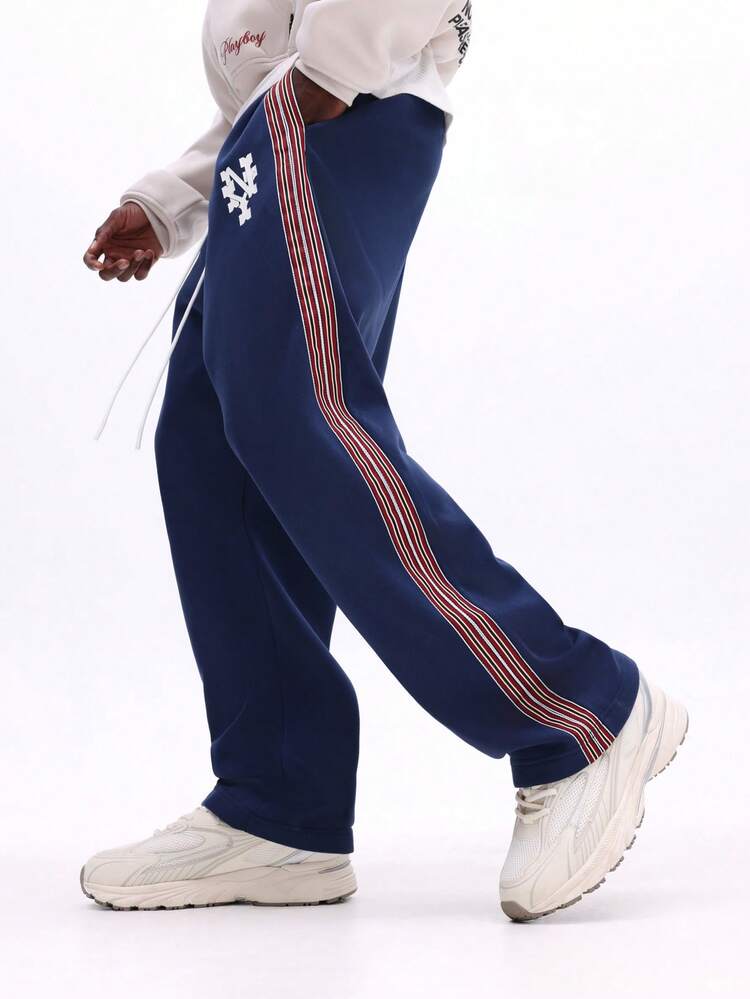 Pantaloni della tuta blu navy con dettaglio a striscia laterale