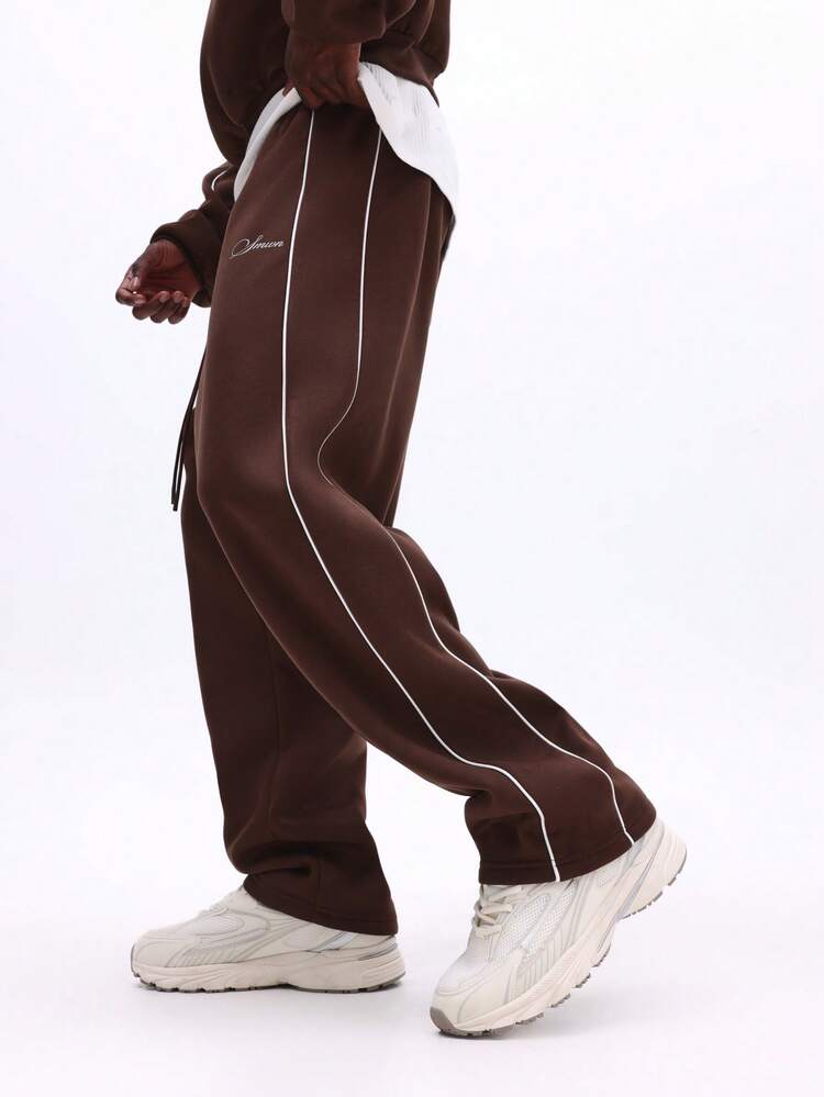 Pantalon de survêtement à entrejambe basse avec détail passepoil