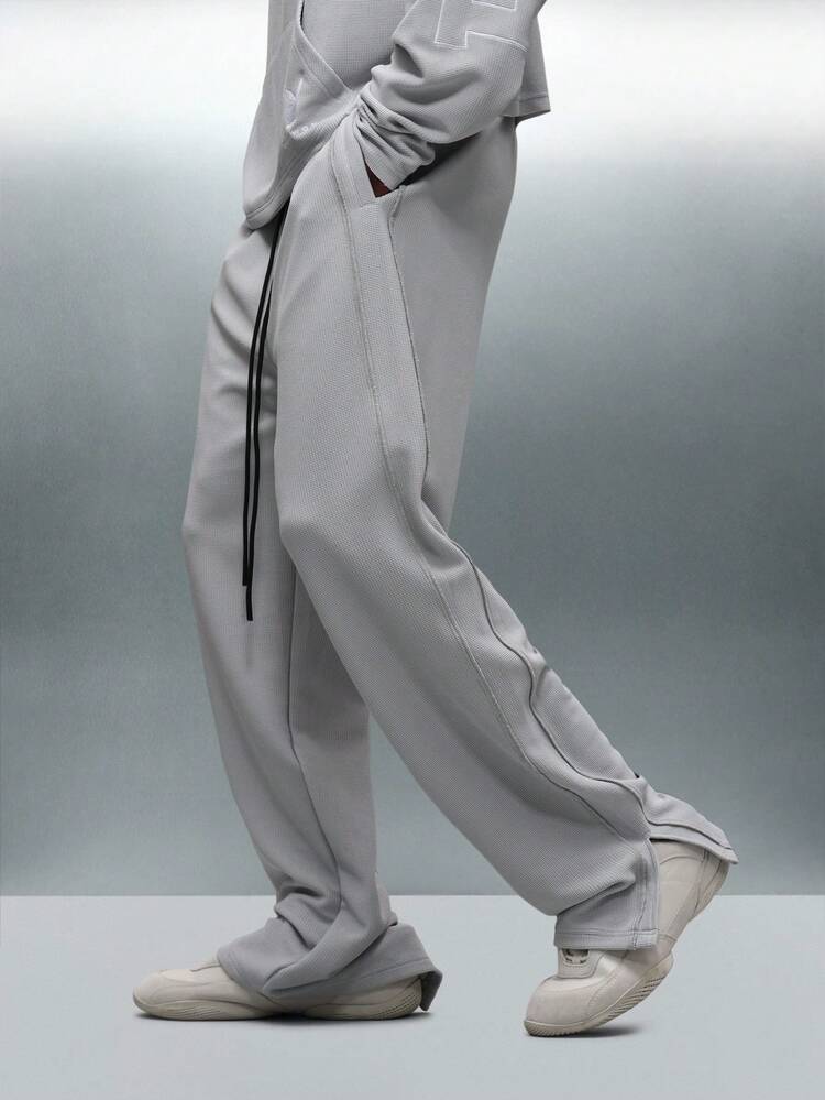 PLAYBOY X SUMWON サイドスリットと切りっぱなしのリラックススウェットパンツ