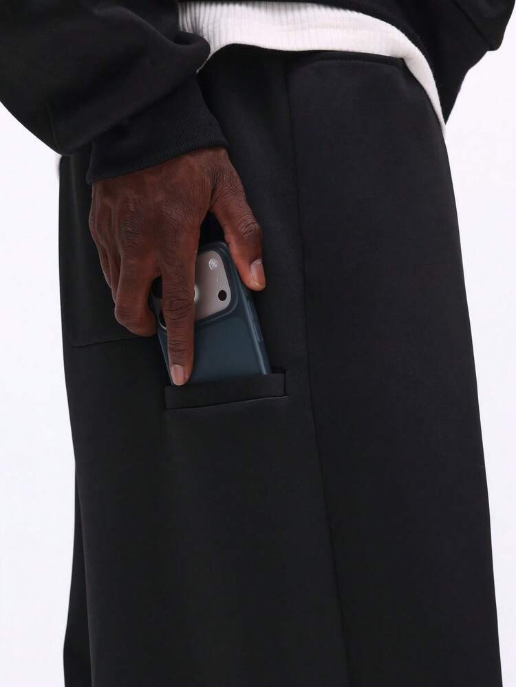 Spodnie dresowe z prostymi nogawkami i kieszenią na telefon