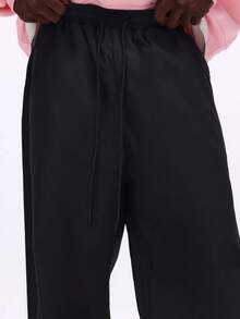 SUMWON Pantalon ample en nylon parachute avec cordon de serrage à la taille, jambes larges, style cargo streetwear, mode urbaine, pantalon ample - Noir - Voir 6