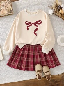 SHEIN 2pcs/Set Fashionable Casual School Style Girls' Apricot Knit Pullover With Bow Print And Red Plaid Pleated Mini Skirt Outfit, Suitable For Outdoor, Travel, Street Style, Daily Casual, Home, Trip, School Season, Daily Matching - Multicolor - View 1
