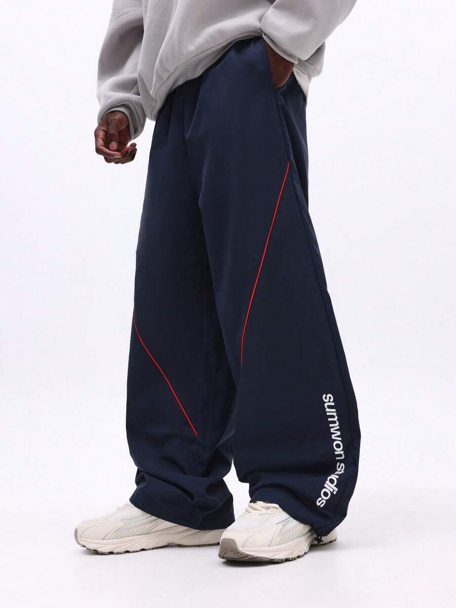 SUMWON Men Nylon Parachute Pants With Contrast Piping And Logo Print ...