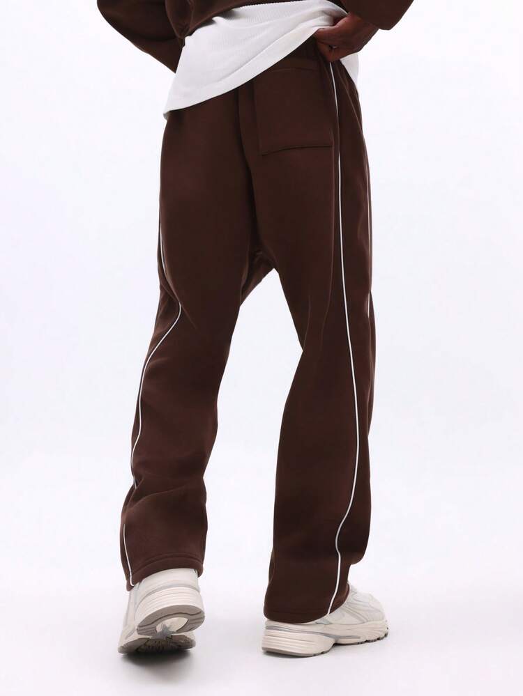 Pantalon de survêtement à entrejambe basse avec détail passepoil