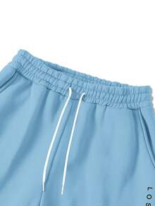 Manfinity Homme Bộ đồ thể thao nam 2 món gồm áo nỉ dài tay in chữ và quần nỉ có túi, thích hợp cho mùa đông, có lớp lót giữ nhiệt. - Màu xanh nhạt - Xem 5