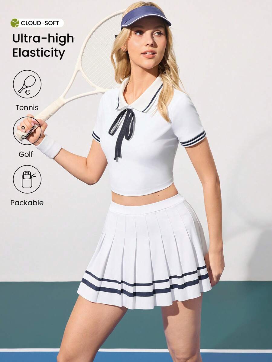 CourtClass 女士撞色蝴蝶结 Polo 领短款修身罗纹拼接上衣和 A 字条纹褶裥二合一半裙运动休闲网球套装 - 白色 - 查看 1