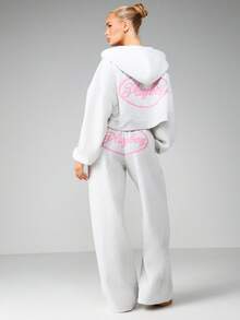 Missguided x Playboy Pantalon de jogging ample à cordon de serrage pour femmes, vêtements de détente casual avec imprimé logo, pantalon confortable pour tous les jours - Gris - Voir 1