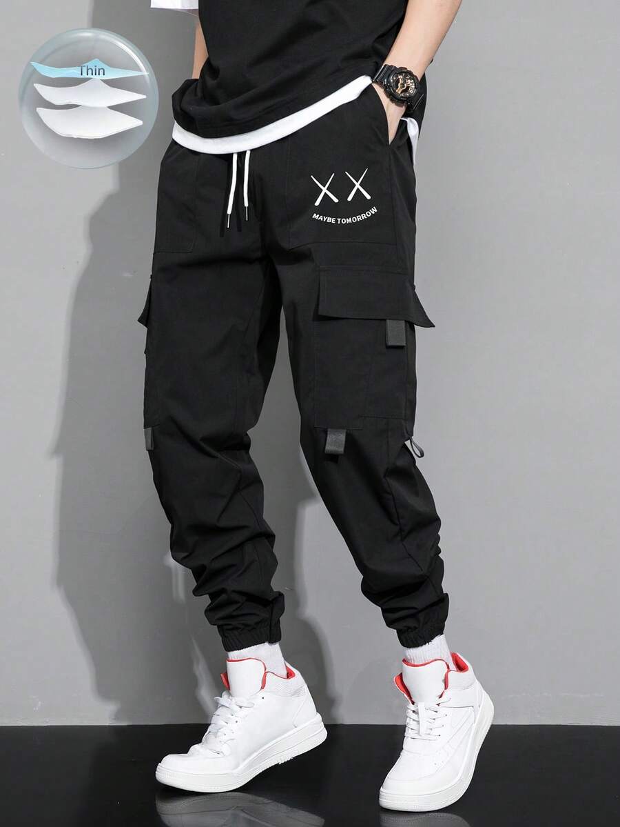 Claim Dot بنطلون رجالي فضفاض بجيب قابل للطي وخصر مربوط بسحاب مطبوع عليه حروف وتعبيرات - الأسود - مشاهدة 1