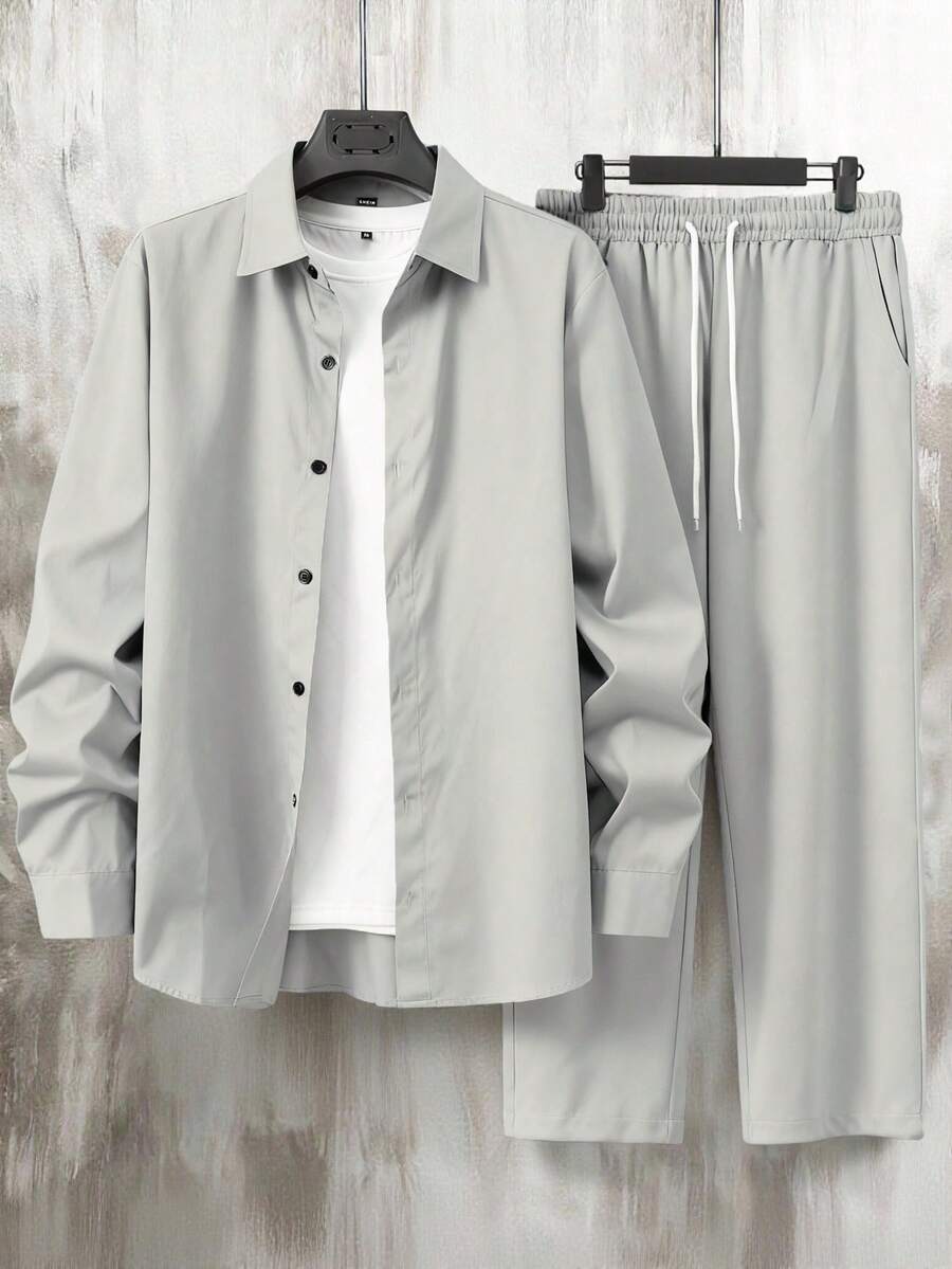 Manfinity Homme 男士休闲纯色两件套衬衫长裤套装,秋季男士休闲上衣和裤子套装,男士休闲套装,男士两件套西装,男士灰白套装,男士衬衫套装,复古风格,适合日常休闲、周末旅行、户外活动、探险旅行、轻松的工作环境或半正式场合,可作为男友/丈夫礼物、周年纪念/生日礼物、派对礼物、圣诞节礼物、新年礼物。 - 淺灰色 - 查看 1