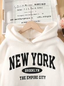 SHEIN 女童针织保暖字母刺绣宽松长袖连帽卫衣（弧形下摆）搭配修身长裤两件套，适合秋冬季节，也可作为姐妹装。 - 黑與白 - 查看 5