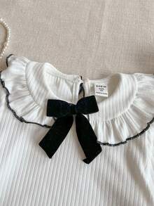 PrepCrw 2pcs Young Girls Elegant Urban Casual Collegiate Versatile White Lace Collar Black Trim Knit Loose Long Sleeve Top And Black Mini Skirt Set, Suitable For Back To School, Casual Outings, Trips, Gatherings, Holidays, Autumn/Winter - Black and White - View 4