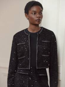 lacRébo Chaqueta corta de estilo tweed negro con sutiles lentejuelas y ribetes contrastantes - Atuendo sofisticado - Negro - Ver 2