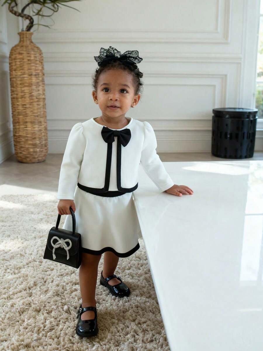 SHEIN 2pcs Baby Girl Cute Sweet Elegant Preppy Fashion White Black Contrast Color Binding Trim Bow Knot Decor Long Sleeve Round Neck Cardigan Jacket Blazer Coat Tops And A-Line Skirt Two Pieces Outfit Sets Suit Soft Clothes For Party Birthday Wedding Photo Shoot Fall Autumn Winter - White - View 1