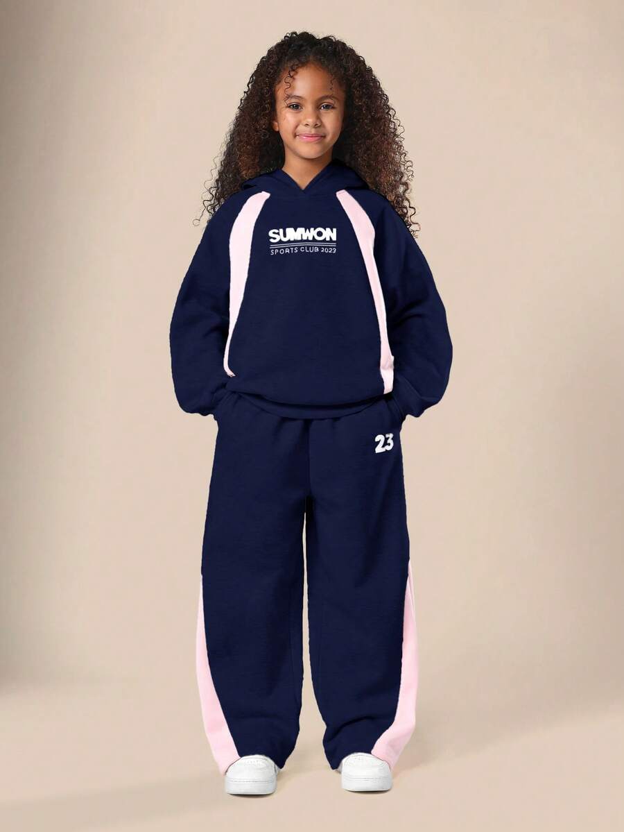 Bộ áo hoodie và áo nỉ phối màu xanh navy dành cho bé gái tuổi teen của SUMWON, với chi tiết phối màu hồng ở hai bên, thích hợp cho các hoạt động thường ngày và kỳ nghỉ. - Màu xanh hải quân - Xem 1