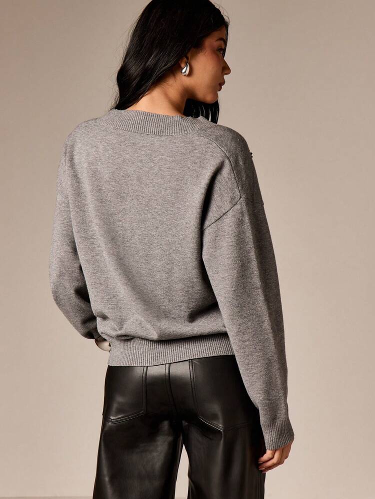 V Neck Sweater With Floral Embellishment