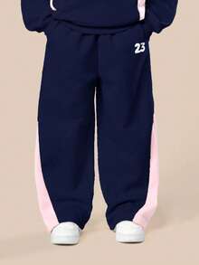 Bộ áo hoodie và áo nỉ phối màu xanh navy dành cho bé gái tuổi teen của SUMWON, với chi tiết phối màu hồng ở hai bên, thích hợp cho các hoạt động thường ngày và kỳ nghỉ. - Màu xanh hải quân - Xem 6