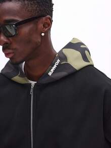 Áo hoodie SUMWON dáng rộng, khóa kéo toàn thân, lót mũ họa tiết rằn ri và túi trước, thích hợp cho phong cách đường phố mùa đông thường ngày. - màu đen - Xem 7