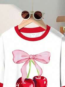 SHEIN Bộ 2 món cho bé gái, kiểu dáng thường ngày dễ thương, phong cách retro Mỹ, in hình nơ và quả anh đào, chấm bi và quả anh đào, viền đỏ, áo tay ngắn cổ tròn và quần ống loe, thích hợp cho mùa hè. - Nhiều màu - Xem 4