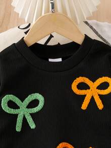 SHEIN Elladie kids Bộ 2 áo nỉ dệt kim dễ thương thường ngày cho bé gái, áo nơ dài tay và chân váy xếp ly màu xanh lá cây, thích hợp mặc vào mùa thu, ngày lễ và mặc hàng ngày - màu đen - Xem 4