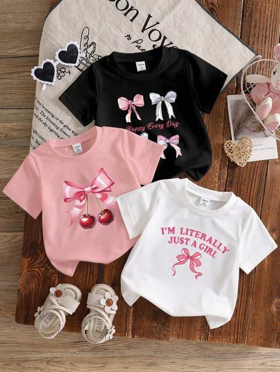 SHEIN Set de 3 piezas de tops de manga corta de punto con cuello redondo, diseño de lazo y gráfico de letras, para bebé niña y niño pequeño de 6 meses a 3 años, ropa básica diaria para niñas bebés y niñas pequeñas, estilo minimalista con decoración de lazo y letras en inglés, adecuado para primavera/verano