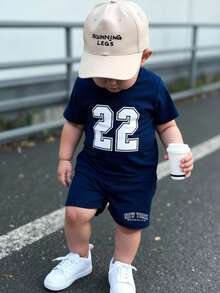 SHEIN 2pcs/Set Baby Boy Sports & Casual Outfit, Digit Print Short Sleeve T-Shirt Paired With Minimalist Text Print Navy Blue Shorts, Suitable For Summer Outings
