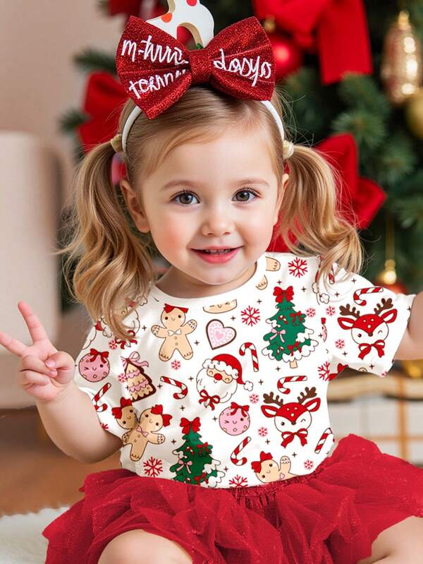 SHEIN Camiseta de manga corta y cuello redondo de estilo minimalista casual para niña, adecuada para Navidad, con estampado de Navidad blanco, Papá Noel lindo y juguetón, hombre de jengibre, reno, árbol de Navidad con lazo, bastón de caramelo, corazón y copo de nieve