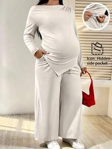 SHEIN 2pcs Maternity Plus Size Solid Color Asymmetric Shoulder Drop Shoulder Long Sleeve Top And Adjustable Waist Wide Leg Pants Casual Outfit Pregnant Outfits Maternity Pants Set Pregnancy Clothes Plus Size Maternity Set Maternity 2 Piece Set - Beige - View 1