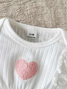 SHEIN Conjunto de top de manga larga con cuello de equipo y pantalones con cintura elástica y lazo rosa para bebé niña, con bordado de corazón acanalado. Cómodo para uso casual, en casa y juegos al aire libre en otoño/invierno