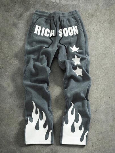 Manfinity Roghcode Pantalones deportivos informales con cordón en la cintura, estampado de letras y llamas, talla grande para hombres