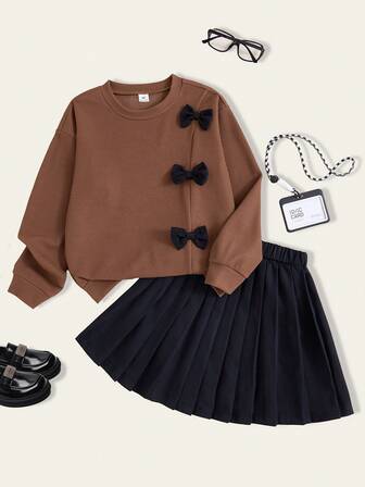 Casuvi Kids 2pcs/Set Teenage Girls Bow Decor Round Neck Sweatshirt And Black Pleated Skirt Set, Cute & Sweet Style, Casual & Versatile, Suitable For Outings, Back To School, Spring/Summer/Autumn