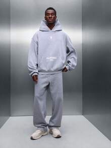 PLAYBOY X SUMWON Conjunto de sudadera con capucha y pantalones joggers de entrepierna caída a juego con bolsillo central - Gris - Ver 1