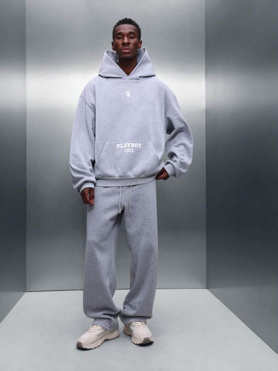 PLAYBOY X SUMWON Conjunto de sudadera con capucha y pantalones joggers de entrepierna caída a juego con bolsillo central - Gris - Ver 1