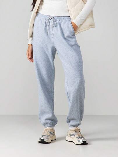 MISSGUIDED 浅蓝色抽绳运动裤，纽扣细节设计，弹性裤脚收口，休闲舒适，适合冬春居家穿着。