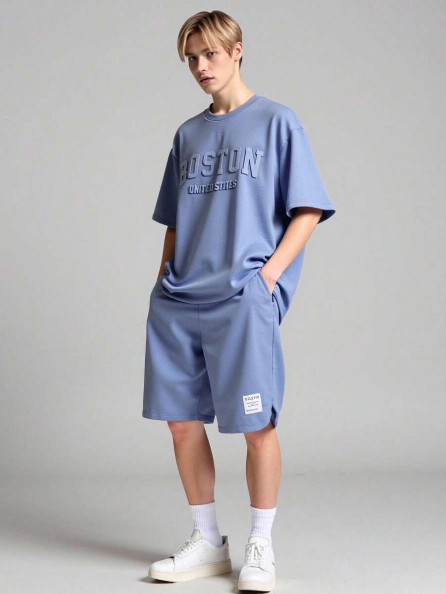 Vacaura 2 件青少年男孩休闲装，时尚图案圆领 T 恤，拱形侧面设计，短裤带有简单的编织标签和拱形下摆，适合夏季和秋季 - 藍色 - 查看 1