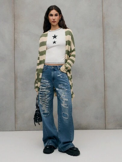 TypaGal Blue Denim Jeans With Bold Distressed Detailing, A Timeless Streetwear Piece That Adds Effortless Edge To Any Casual