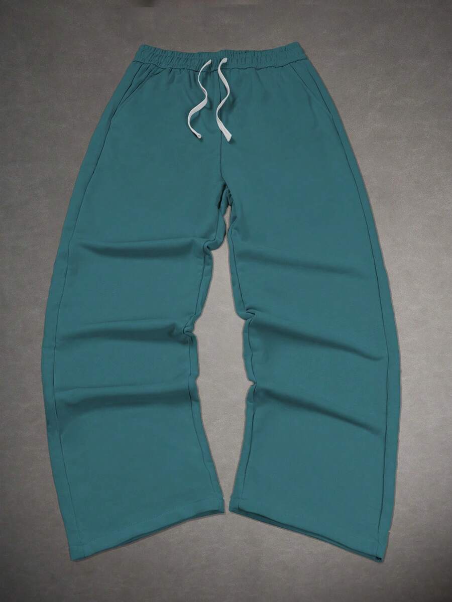 Manfinity Hypemode Pantalones de chándal con cordón en la cintura para hombre de corte holgado - Verde Oscuro - Ver 1
